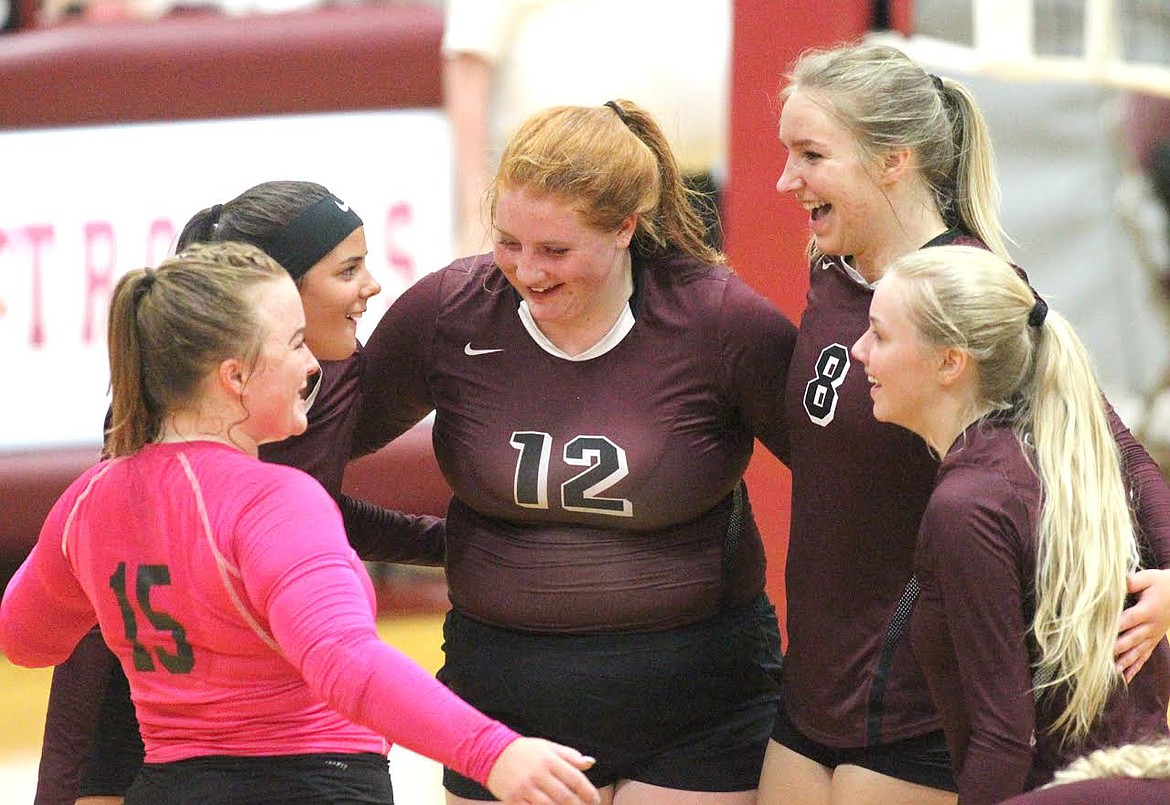 Troy volleyball players Mazzy Hermes, left, Talise Becquart, Montana Rice, Ella Pierce and Leah Clay celebrate after they tied Stillwater at 21 in first game. (Paul Sievers/The Western News)
