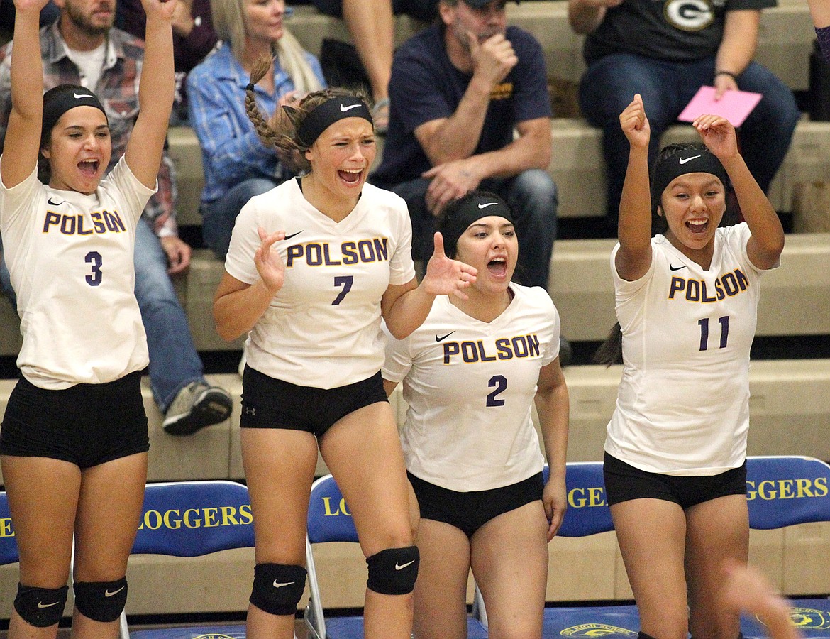 The bench explodes as Polson defeats Libby in four: 25-19, 26-24, 23-25, 25-15. With Chloe DuCharme, left, Elizabeth Tolley, Savanna Carpentier and Layla Reese. (Paul Sievers/TWN)