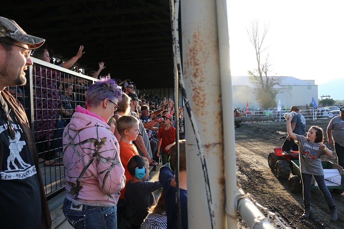 Photo by MANDI BATEMAN
Addy Mae throws t-shirts to the excited fans during the demolition derby.