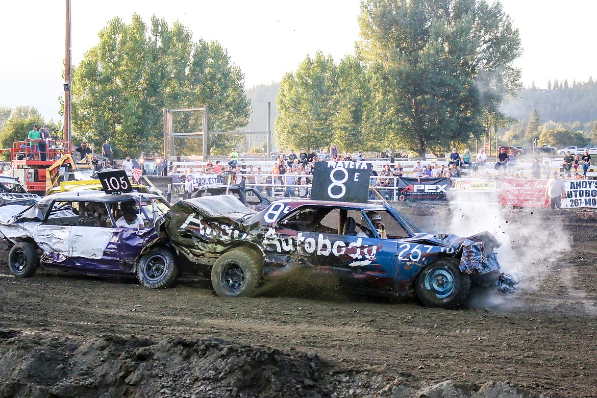 Photo by MANDI BATEMAN
Andy Falck in the number 8 car and Garrid Larsen in the 105 car, giving the audience something to cheer about.