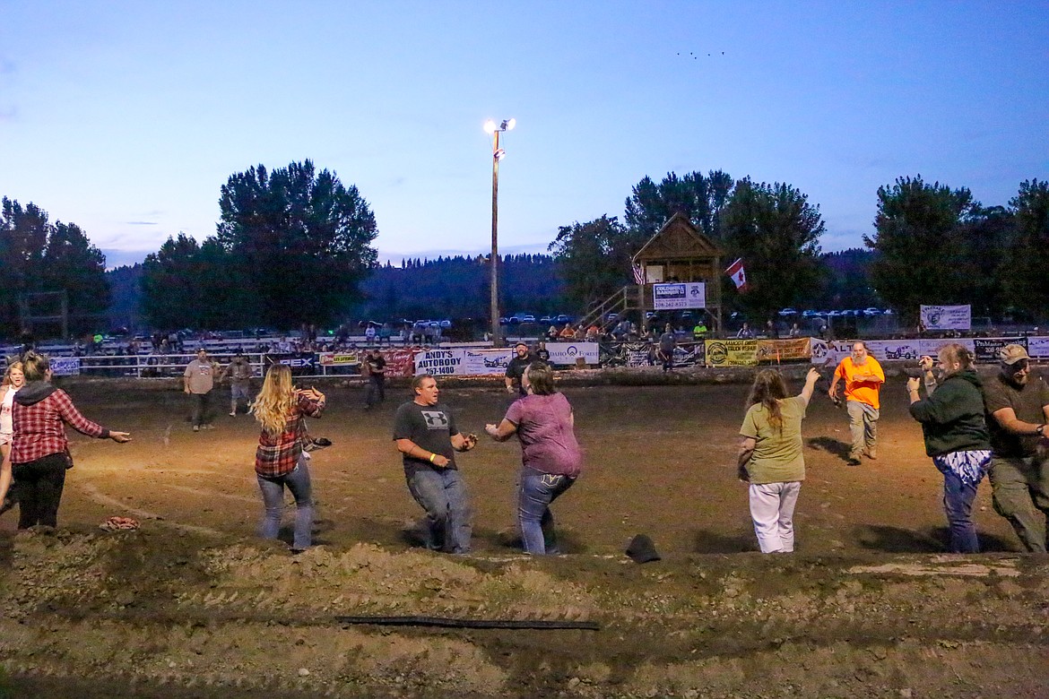 Photo by MANDI BATEMAN
Competion for couples that left some dizzy and one in the dirt, after having to spin around ten times with their eyes closed, before running.