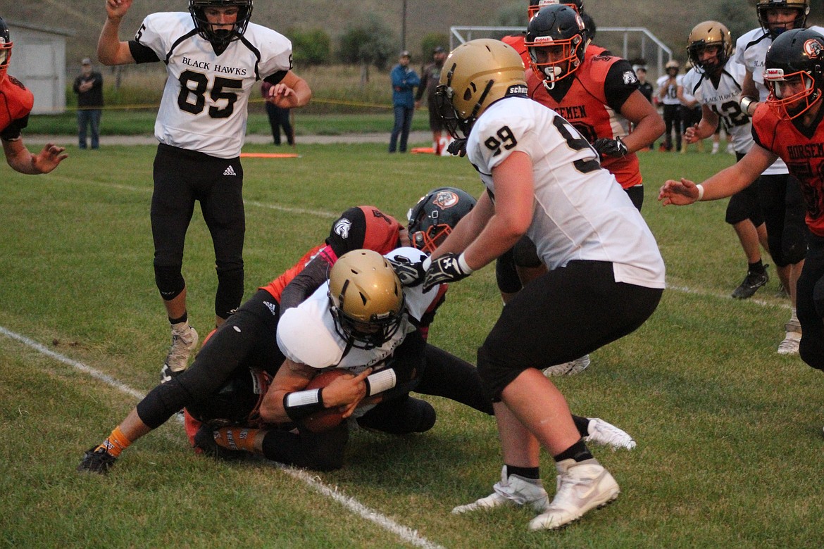 TREYDON BROUILLETTE tackling the carrier just yards short of the end zone. (John Dowd/Clark Fork Valley Press)