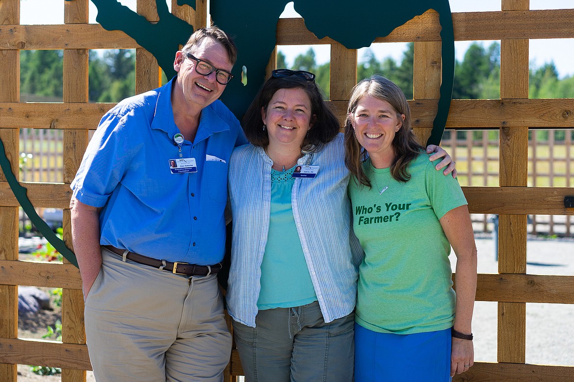 Alan Satterlee, Executive Director of the North Valley Hospital Foundation, nurse Kelly Avanzino, and Gretchen Boyer, Executive Director of Farm Hands, pose in front of the North Valley Hospital&#146;s Planetree Healing Garden. (Daniel McKay/Whitefish Pilot)