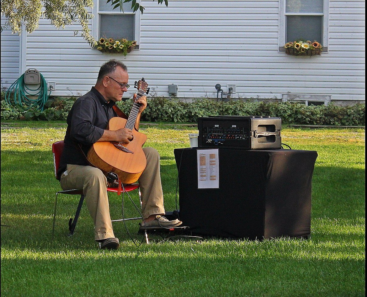 Photo by TONIA BROOKS
 Ralph Walker provided musical entertainment on his acoustic guitar.