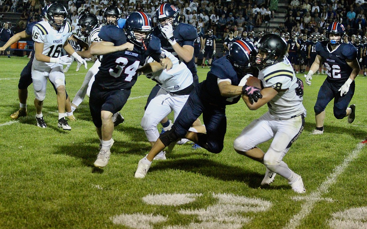 Casey McCarthy/ Columbia Basin Herald Royal's Lorenzo Myrick collides with the Ellensburg defender. The Knights moved on to win the game 21-16.