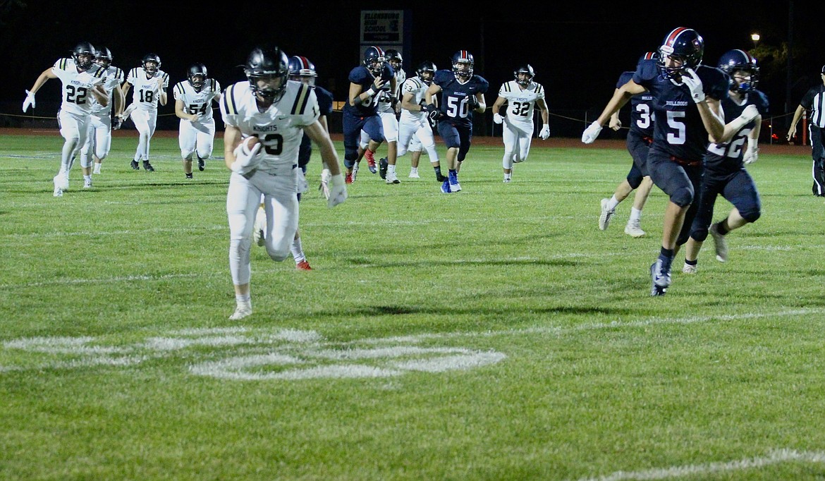 Casey McCarthy/ Columbia Basin Herald Royal wide receiver Cooper Christensen rushes to the edge after making the catch on Friday night.