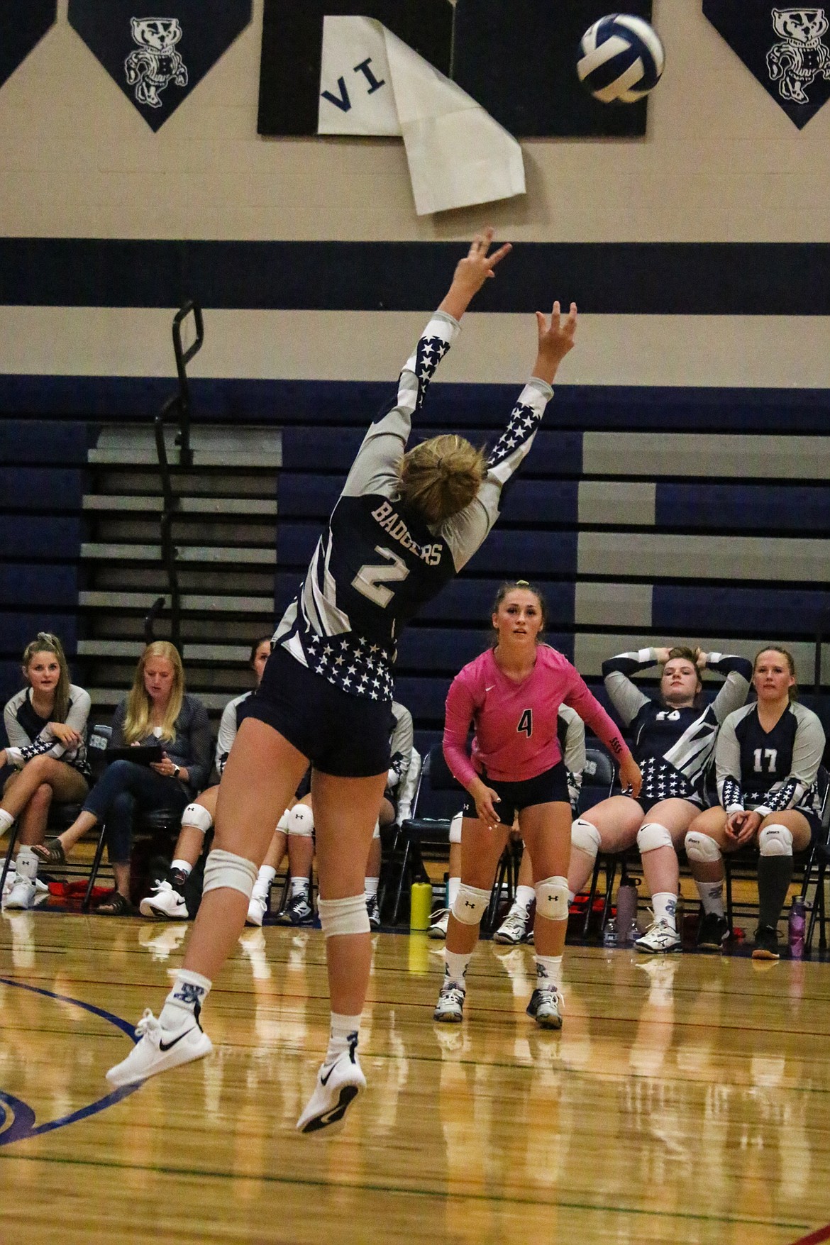 Senior Grace Villelli sets the ball as libero Lexi Maas looks on during the Badgers&#146; Sept. 3 match against Sandpoint.

More volleyball photos appear on page B9.
Photo by MANDI BATEMAN