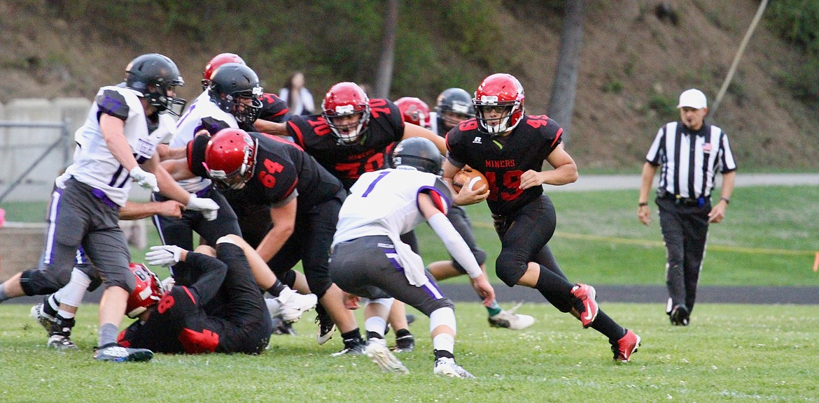 Photo by JOSH MCDONALD
Wallace&#146;s Diego Collier looks to break a run off against Mullan.