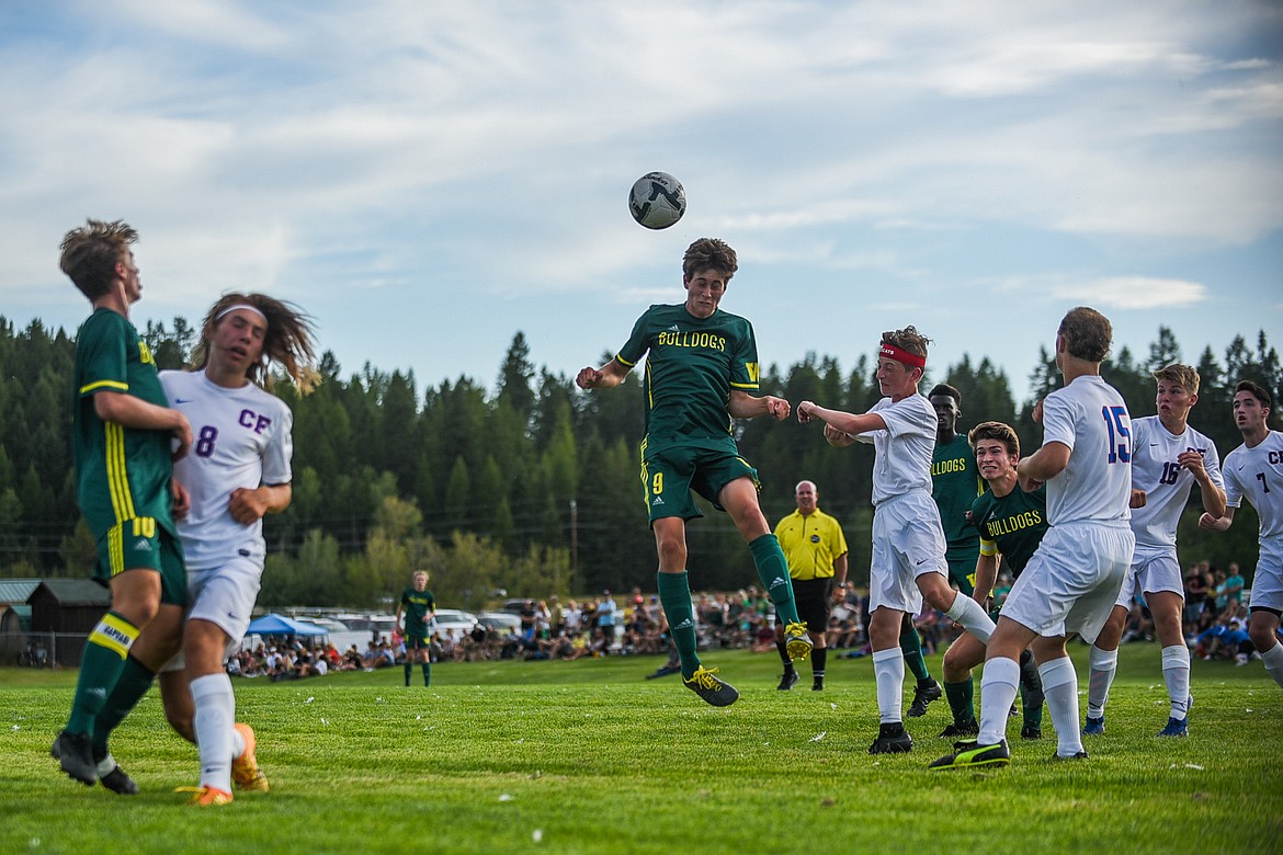 Gabe Menicke hits a header against Columbia Falls last Tuesday. (Daniel McKay/Whitefish Pilot)