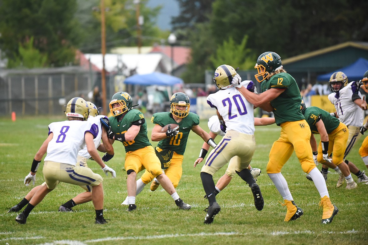 Devin Beale finds the hole during Whitefish's 28-15 home win over Polson on Friday. (Daniel McKay/Whitefish Pilot)