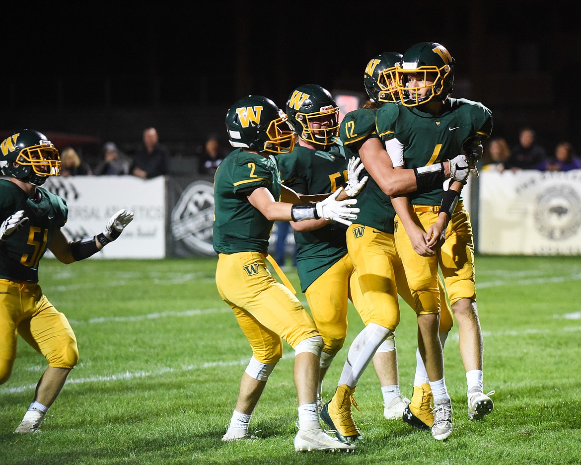 A pack of Bulldogs swarm Jaxsen Schlauch after a late touchdown against Polson. (Daniel McKay/Whitefish Pilot)