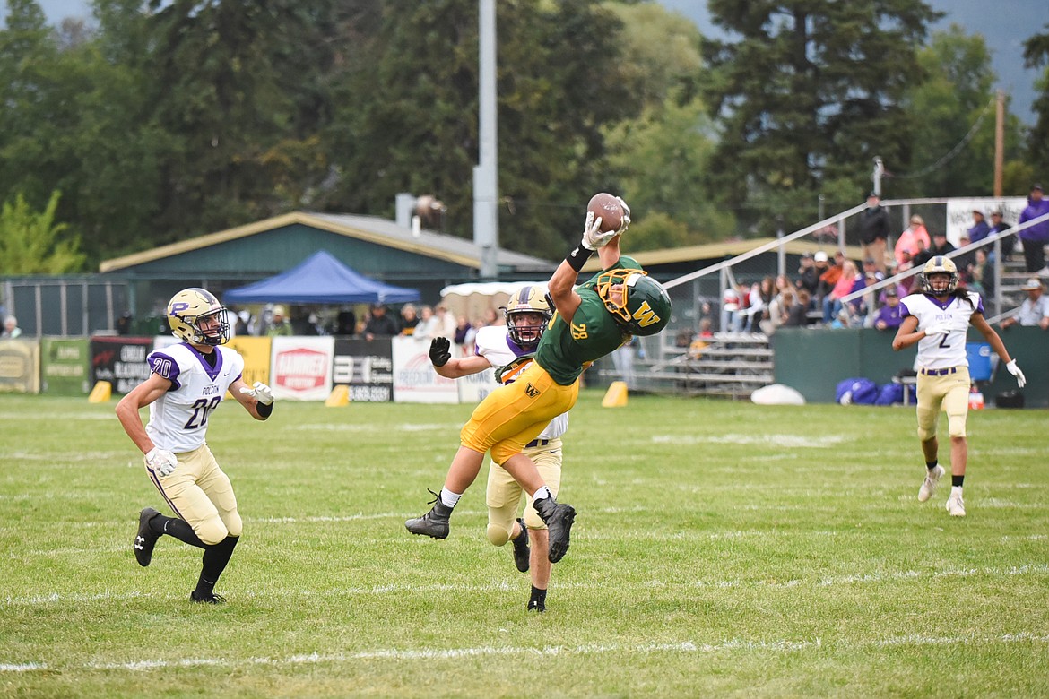 Zach Veneman soars through the air for the big catch during Whitefish&#146;s 28-15 home win over Polson on Friday. (Daniel McKay/Whitefish Pilot)