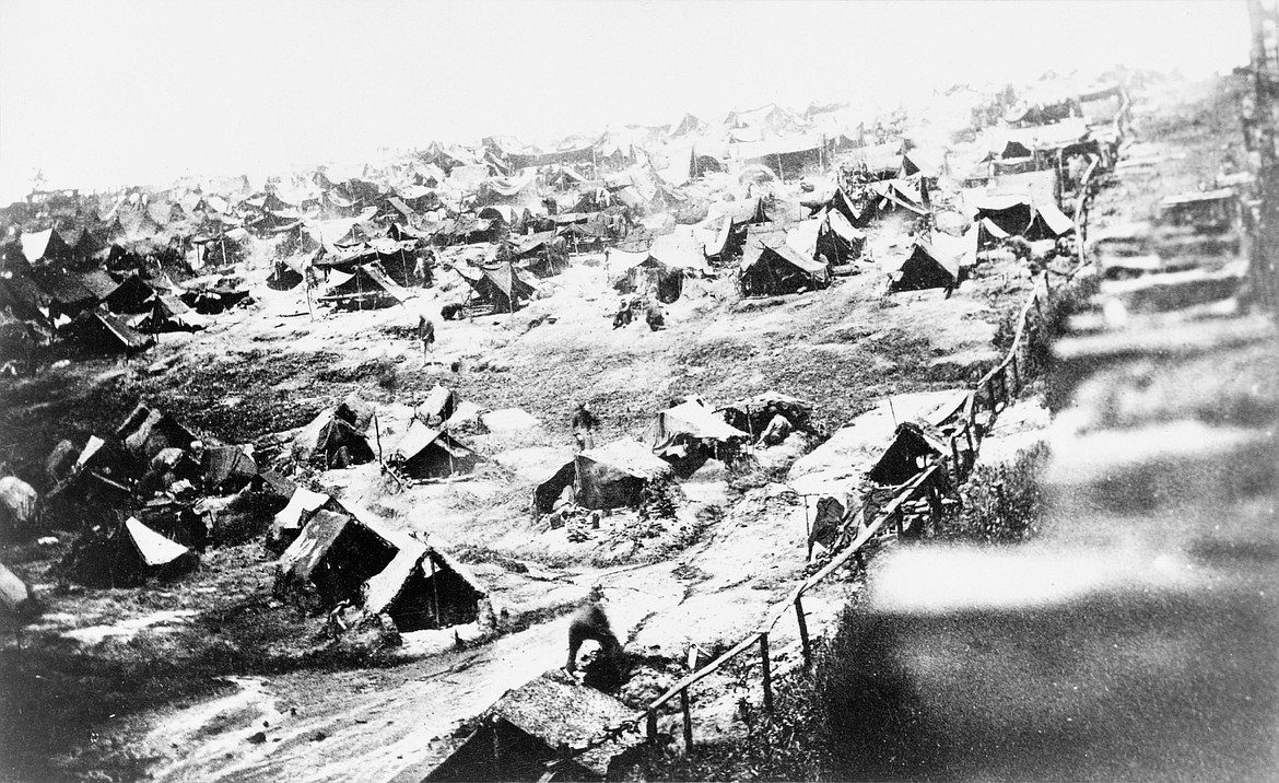 LIBRARY OF CONGRESS
Living conditions at Andersonville, showing restricted strip where prisoners violating the no-go rule would be shot by guards in watchtowers.