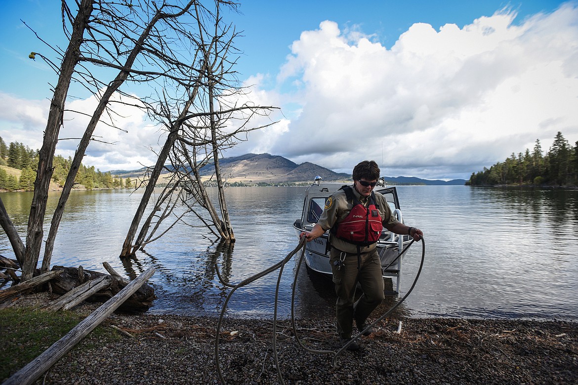 Amy Grout, park management specialist with Montana Fish, Wildlife and Parks, ties up the boat in Skeeko Bay on Wild Horse Island State Park on Thursday, Sept. 19. (Casey Kreider/Daily Inter Lake)