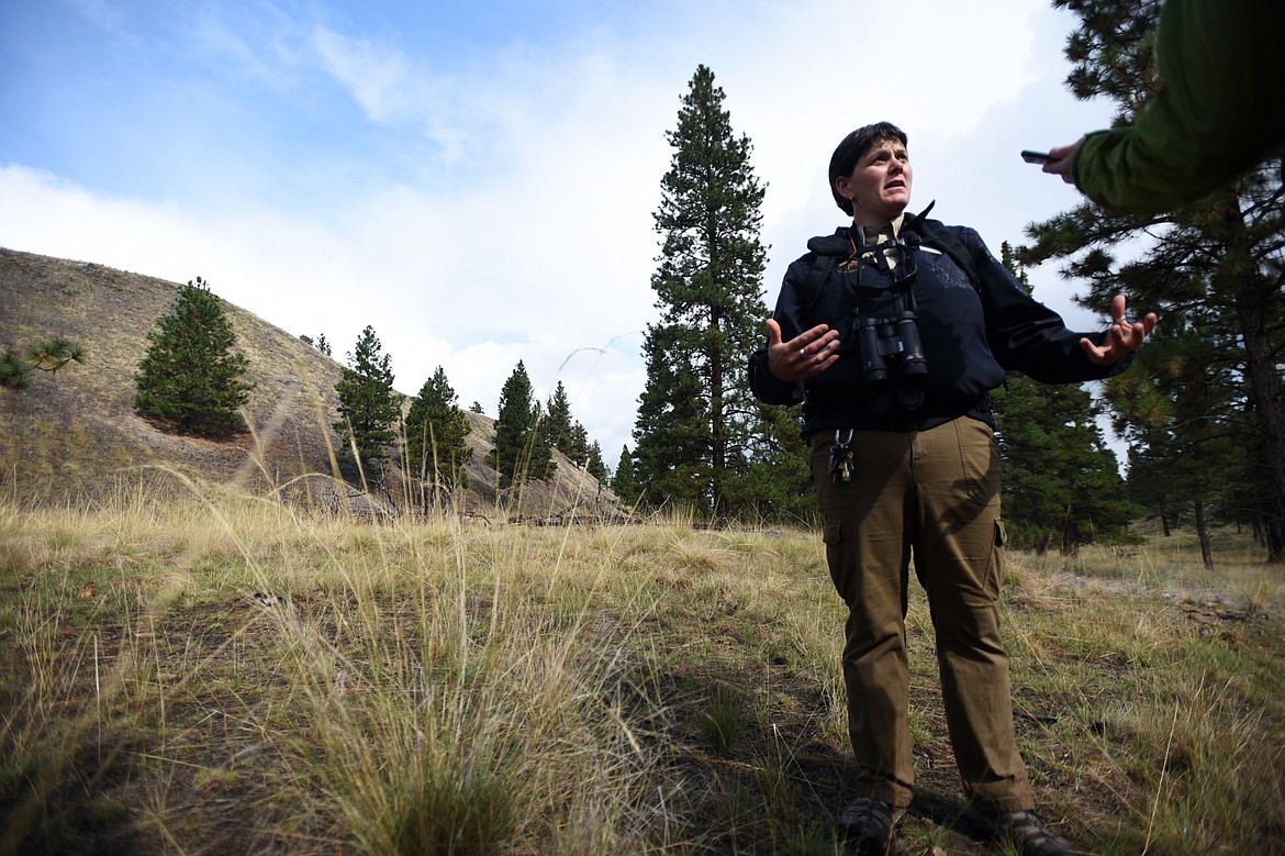 Amy Grout, park management specialist with Montana Fish, Wildlife and Parks, discusses methods of eliminating cheat grass at a test plot on Wild Horse Island State Park on Thursday, Sept. 19. (Casey Kreider/Daily Inter Lake)