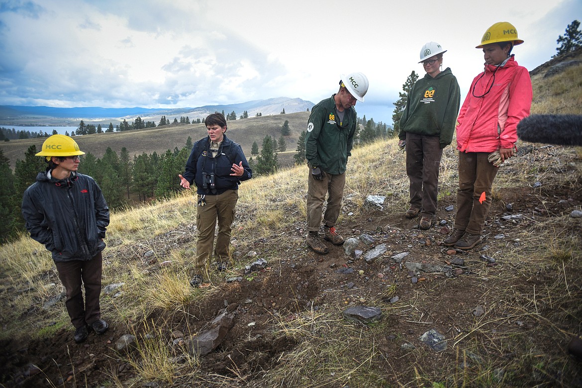 Amy Grout, second from left, discusses trail work done by members of the Montana Conservation Corps, from left, Drew Mayberry, Paul Timm, Kate Bickerstaff and Rosalie Ramirez on Wild Horse Island State Park on Thursday, Sept. 19. (Casey Kreider/Daily Inter Lake)