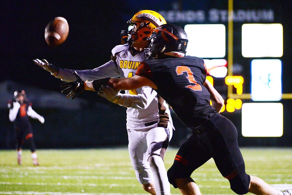 Helena Capital defensive back Anthony Guccione (4) breaks up a pass in the end zone intended for Flathead wide receiver Chance Sheldon-Allen (3) in the second quarter at Legends Stadium on Friday. (Casey Kreider/Daily Inter Lake)