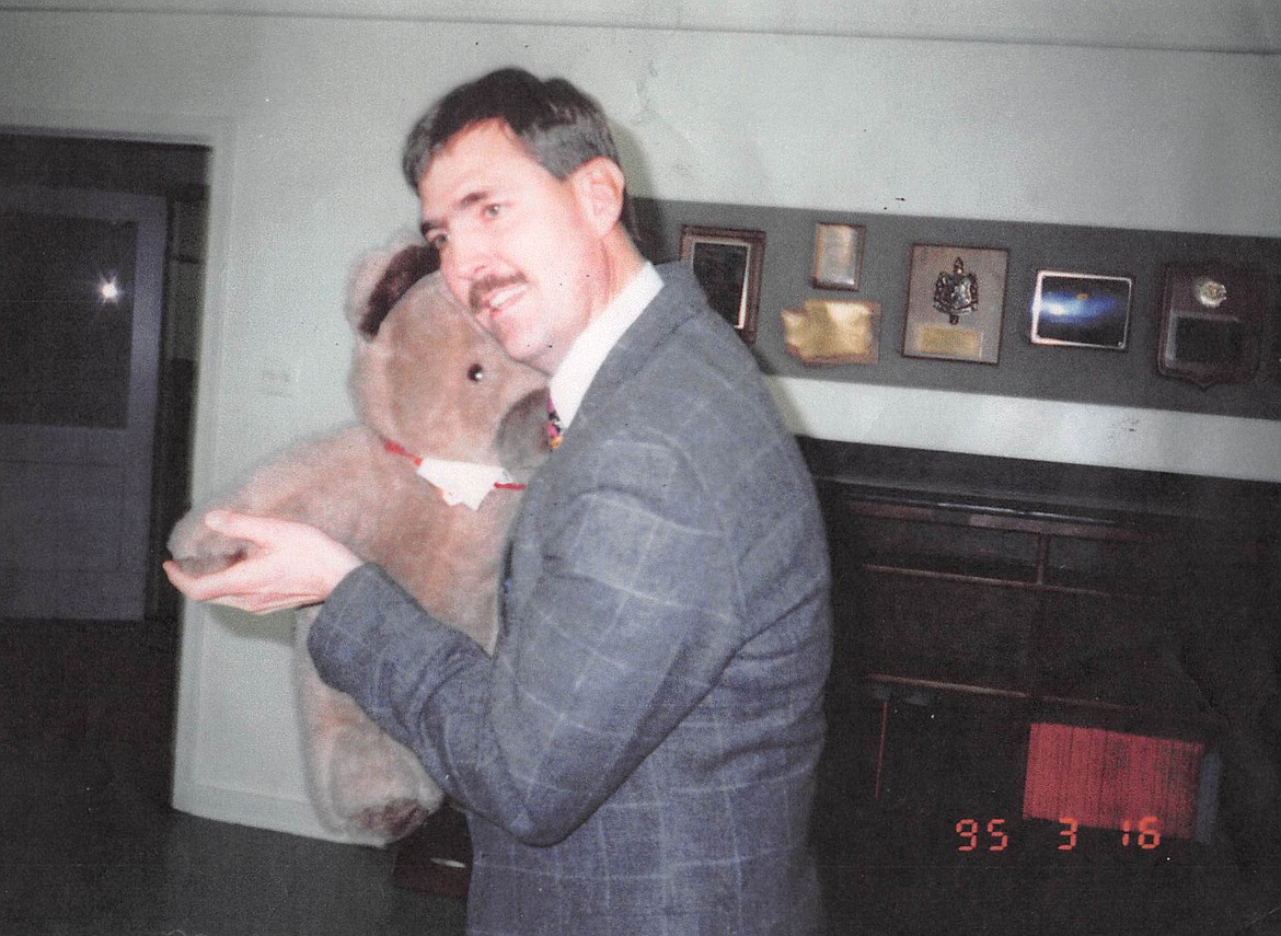 Jerry Keane dances with a teddy bear in March 1995 when he was assistant superintendent of the Post Falls School District. (Courtesy photo)