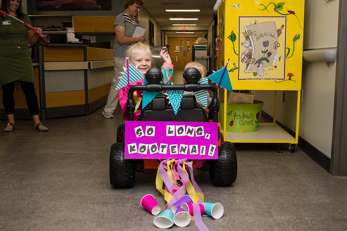 ANDREA NAGEL/Kootenai Health
Six-year-old Kootenai Health patient Gemma Farrell waves &#147;bye bye&#148; as she cruises around the hospital on Wednesday. Gemma, her family and Kootenai Health staff celebrated her last IV session for systemic juvenile rheumatoid arthritis, the rare pediatric disease she has been treated for since early last year.