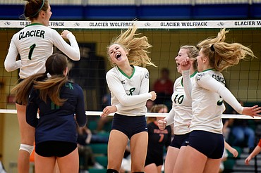 From left, Glacier's Sidney Gulick (1), Alyssa AuClaire (11), Aubrie Rademacher (8), Kynzie Mohl (10) and Kaylee Fritz (5) celebrate after a point against Flathead during crosstown volleyball at Glacier High School on Thursday. (Casey Kreider/Daily Inter Lake)