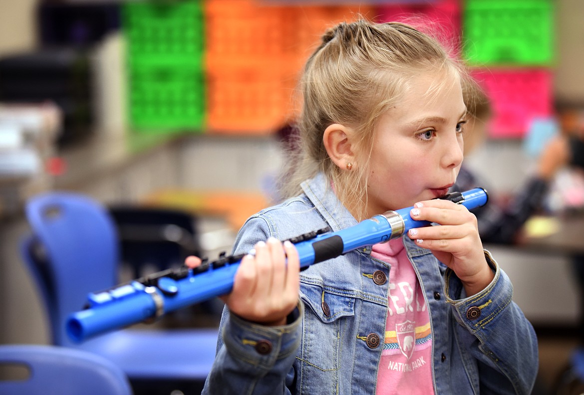 Avery Nellen, a fourth grader at Cayuse Prairie, practices with of one of the flutes purchased with money raised through crowdfunding, in Jennifer Murrell&#146;s class on Friday, September 20. (Brenda Ahearn/Daily Inter Lake)