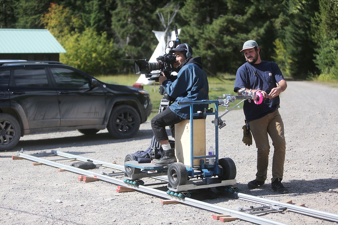Crew members film a scene including more than a dozen background actors and lead actress, Ann Dowd, on Sept. 22 in Columbia Falls. (Mackenzie Reiss/Daily Inter Lake)