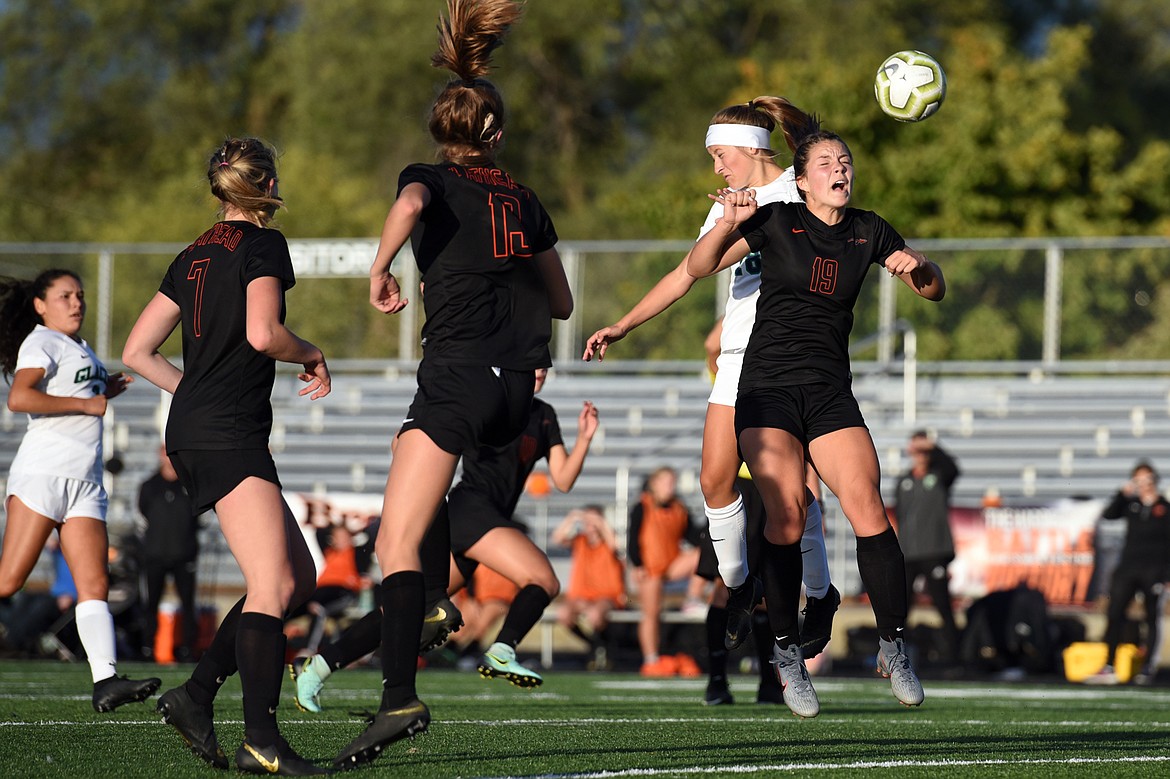 Flathead's Bridget Crowley (19) and Glacier's Madison Becker (18) battle for a ball during crosstown soccer at Legends Stadium on Tuesday. (Casey Kreider/Daily Inter Lake)