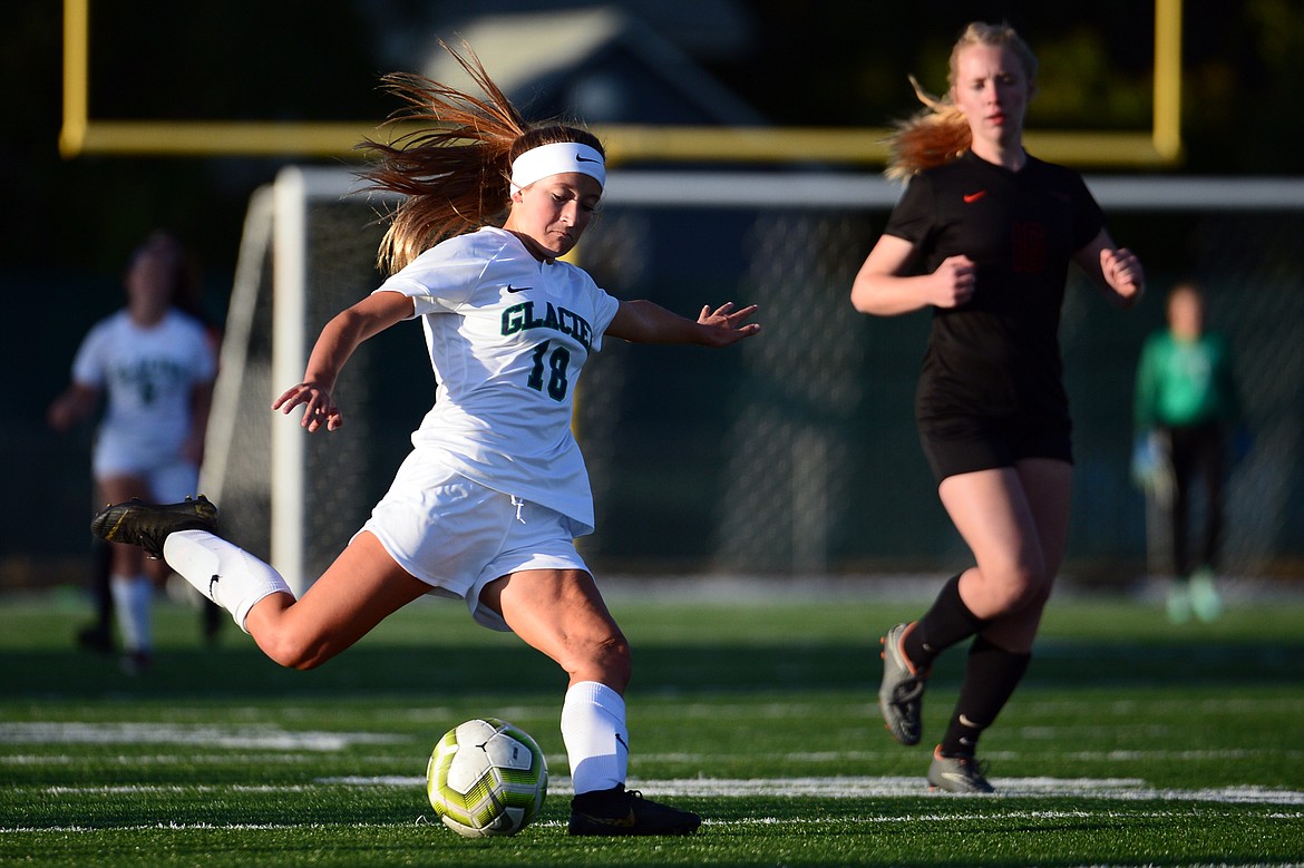 Glacier's Madison Becker (18) kicks a shot on goal against Flathead during crosstown soccer at Legends Stadium on Tuesday. (Casey Kreider/Daily Inter Lake)