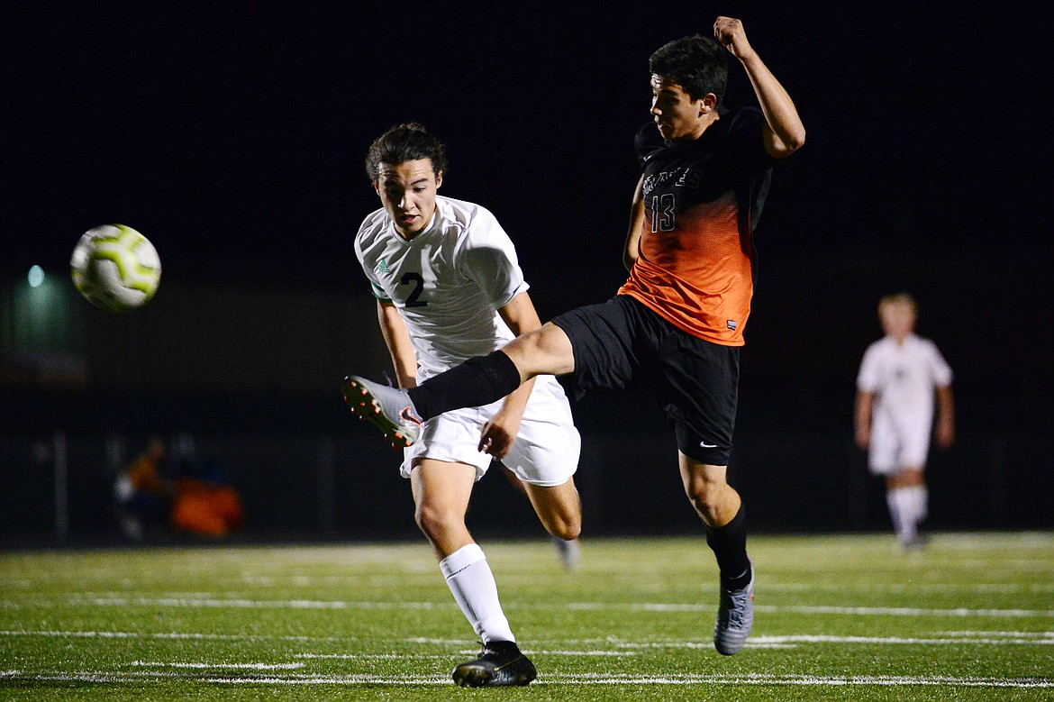 Glacier's Diego Mendoza (2) and Flathead's Arsen Sokolov battle for possession in the first half during crosstown soccer at Legends Stadium on Tuesday. (Casey Kreider/Daily Inter Lake)