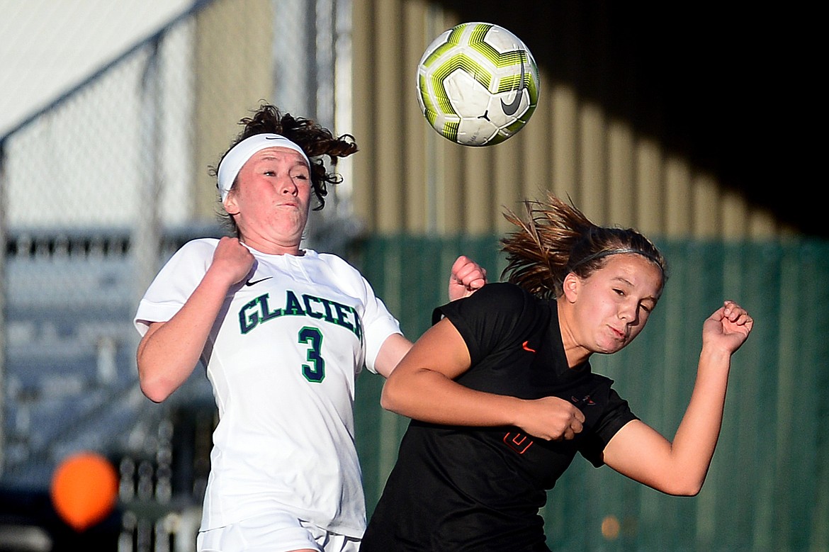 Glacier's Emma Paulson (3) and Flathead's Rylee Barnes (3) battle for a ball during crosstown soccer at Legends Stadium on Tuesday. (Casey Kreider/Daily Inter Lake)