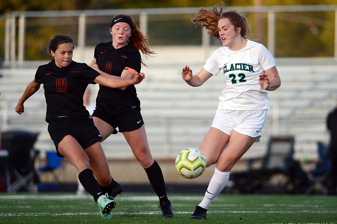 Flathead's Ashlynn Whiteman (10) looks to shoot with Glacier's Kenzie Williams (22) defending during crosstown soccer at Legends Stadium on Tuesday. (Casey Kreider/Daily Inter Lake)