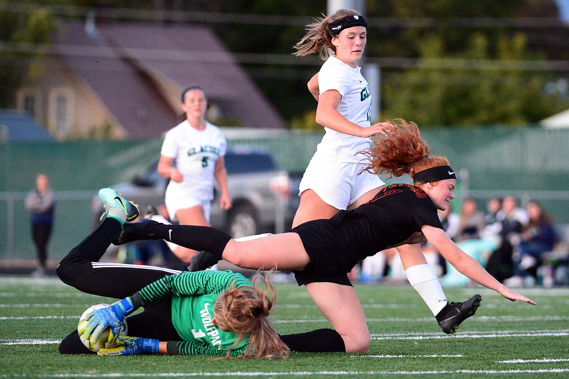 Glacier goalkeeper Sophie Smith (1) makes a save against Flathead's Skyleigh Thompson (9) during crosstown soccer at Legends Stadium on Tuesday. (Casey Kreider/Daily Inter Lake)