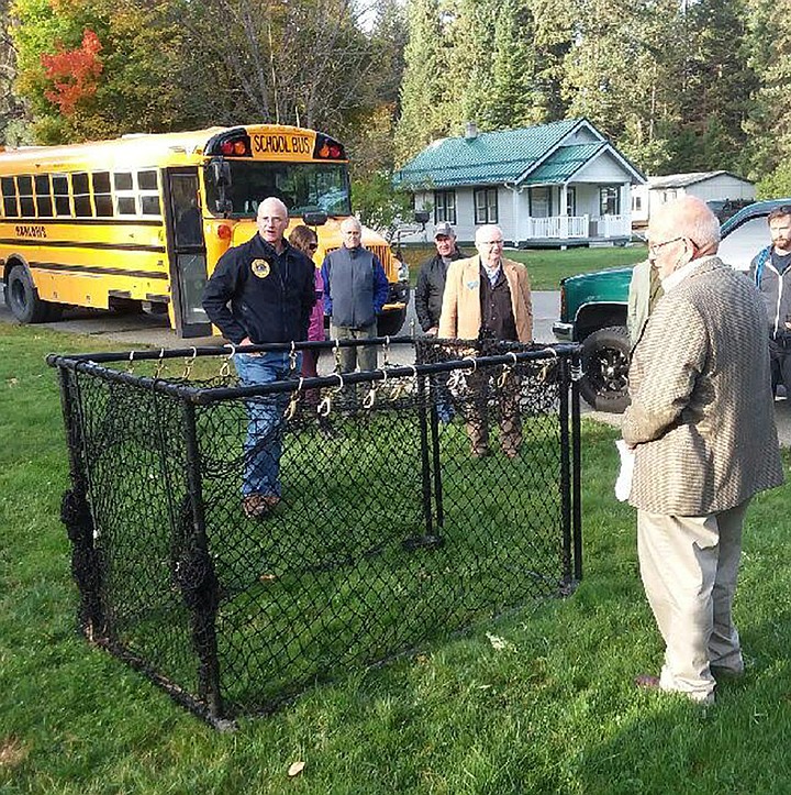 MONTANA FISH, Wildlife and Parks Region 1 Wildlife Program Manager Neil Anderson shows state legislators the clover traps that the agency is using to trap white-tailed deer in the Libby area. Anderson said the traps cost about $300 to build. To date, 10 whitetails have been found to have chronic wasting disease in the Libby CWD Management Zone. (Scott Shindledecker/The Western News)