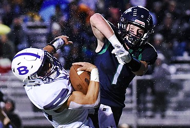 Glacier defensive back Colin Bowden (1) sends Butte running back Kameron Moreno (34) to the ground on a second quarter run at Legends Stadium on Friday. (Casey Kreider/Daily Inter Lake)