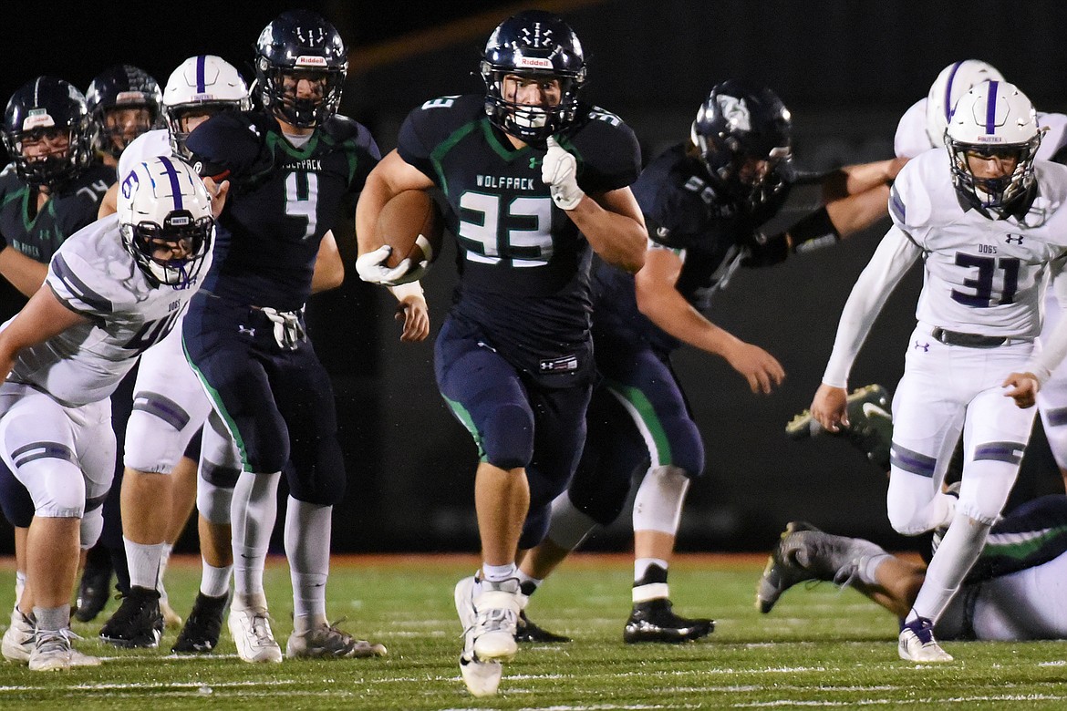 Glacier running back Jake Rendina (33) breaks free up the middle on a third quarter run against Butte at Legends Stadium on Friday. (Casey Kreider/Daily Inter Lake)