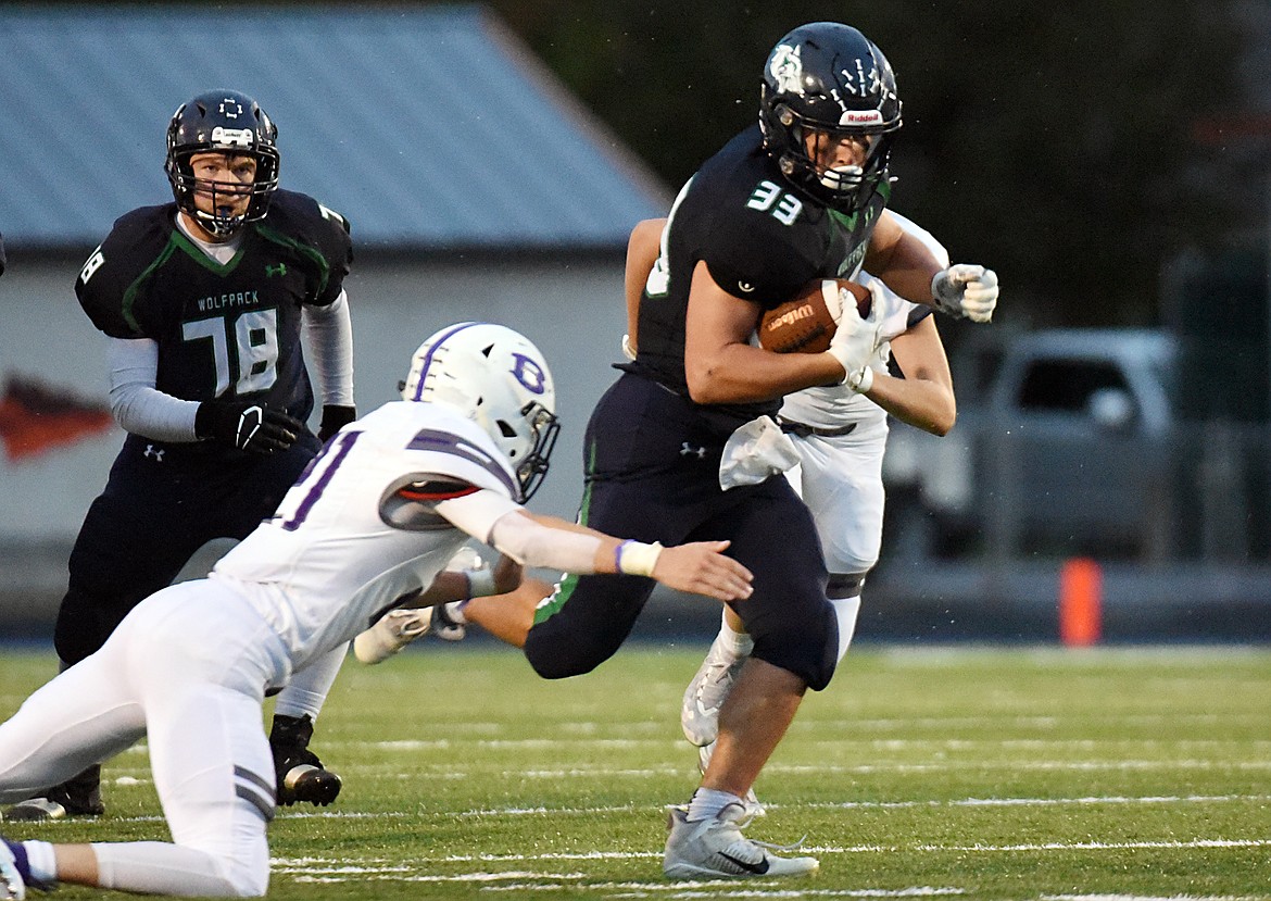Glacier running back Jake Rendina (33) breaks into the Butte secondary on a first half run at Legends Stadium on Friday. (Casey Kreider/Daily Inter Lake)