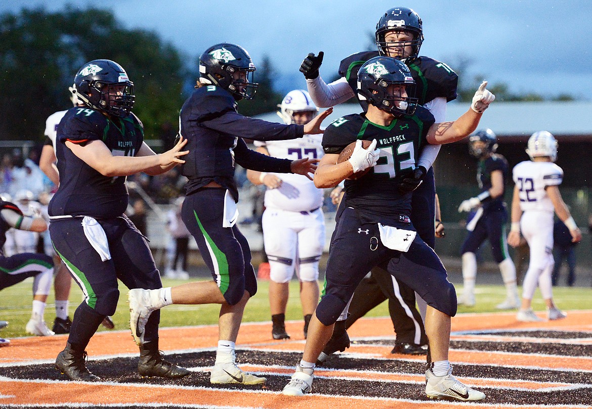 Glacier running back Jake Rendina (33) celebrates with teammates after a first-quarter touchdown run against Butte at Legends Stadium on Friday. (Casey Kreider/Daily Inter Lake)