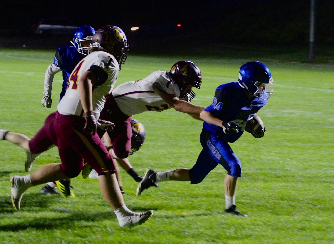 Casey McCarthy/Columbia Basin Herald Warden running back Cael Cox scores the touchdown for the Cougars on Friday night at Warden High School.