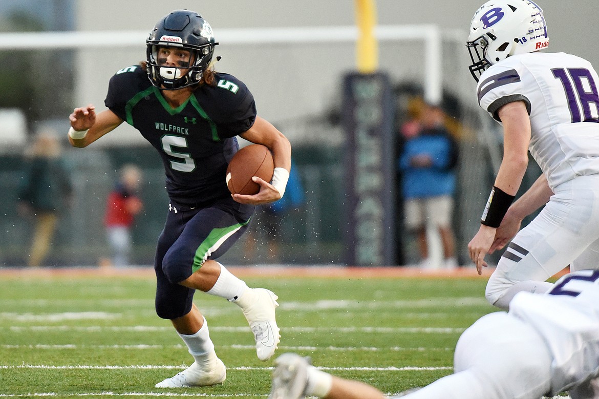 Glacier wide receiver Drew Deck (5) turns upfield after catching a pass in the first quarter against Butte at Legends Stadium on Friday. (Casey Kreider/Daily Inter Lake)