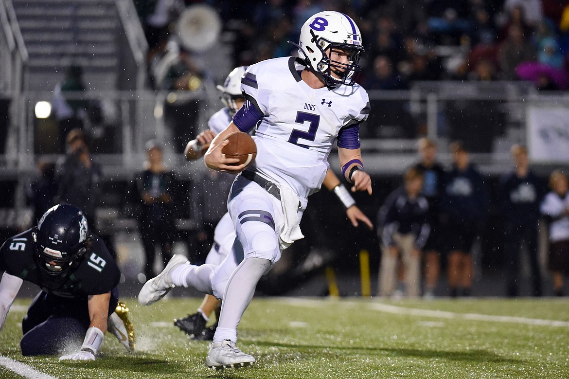 Butte quarterback Tommy Mellott (2) takes off running against Glacier at Legends Stadium on Friday. (Casey Kreider/Daily Inter Lake)