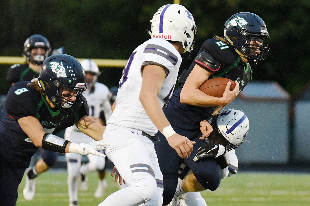 Glacier kick returner Casey Peiffer (21) returns a kickoff in the first half against Butte at Legends Stadium on Friday. (Casey Kreider/Daily Inter Lake)