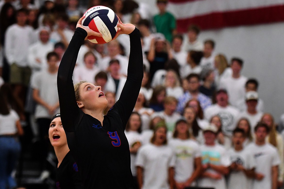 Hannah Schweikert set the ball back to teammate Kiera Brown during the first set against Whitefish last week. (Jeremy Weber photo)