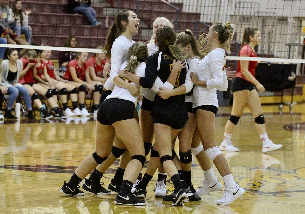 Casey McCarthy/ Columbia Basin Herald Moses Lake High School volleyball team celebrates after their five-set victory over Othello on Monday night.