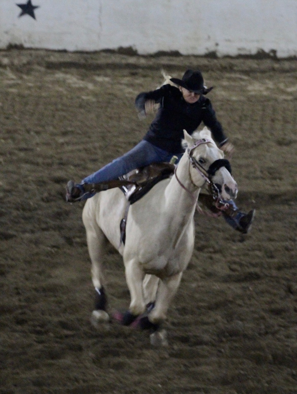 Casey McCarthy/ Columbia Basin Herald Mary Ann Munkers makes her way around the arena during the barrel racing event at the Othello Rodeo on Saturday night.