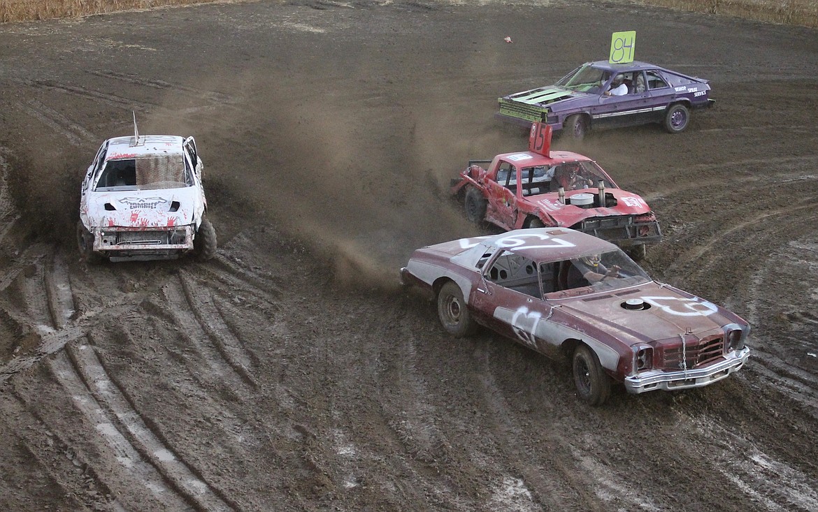 Casey McCarthy/ Columbia Basin Herald Butch Daniels, #67 races ahead of the pack in Heat Race #6 at the Othello Demolition Derby on Wednesday night.