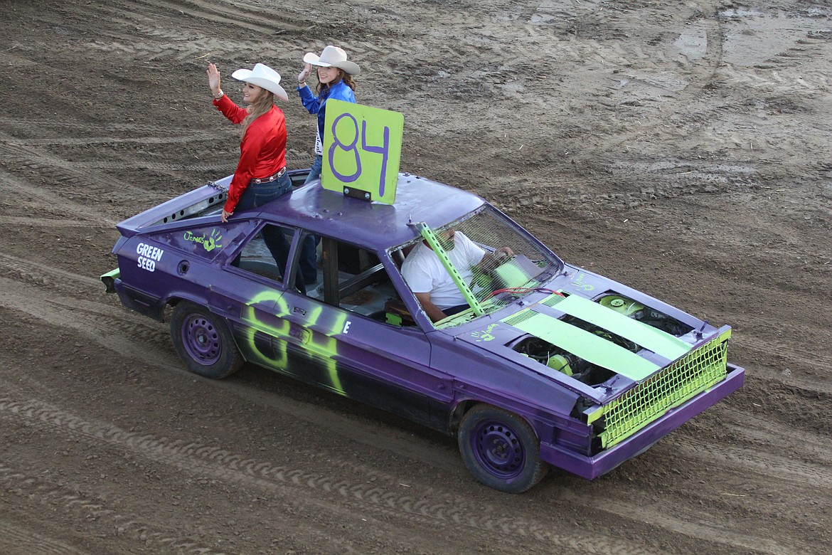 Casey McCarthy/ Sun Tribune
#84, with rodeo queens in tow, makes his way around the track as the Demolition Derby gets set to begin on Wednesday in Othello.