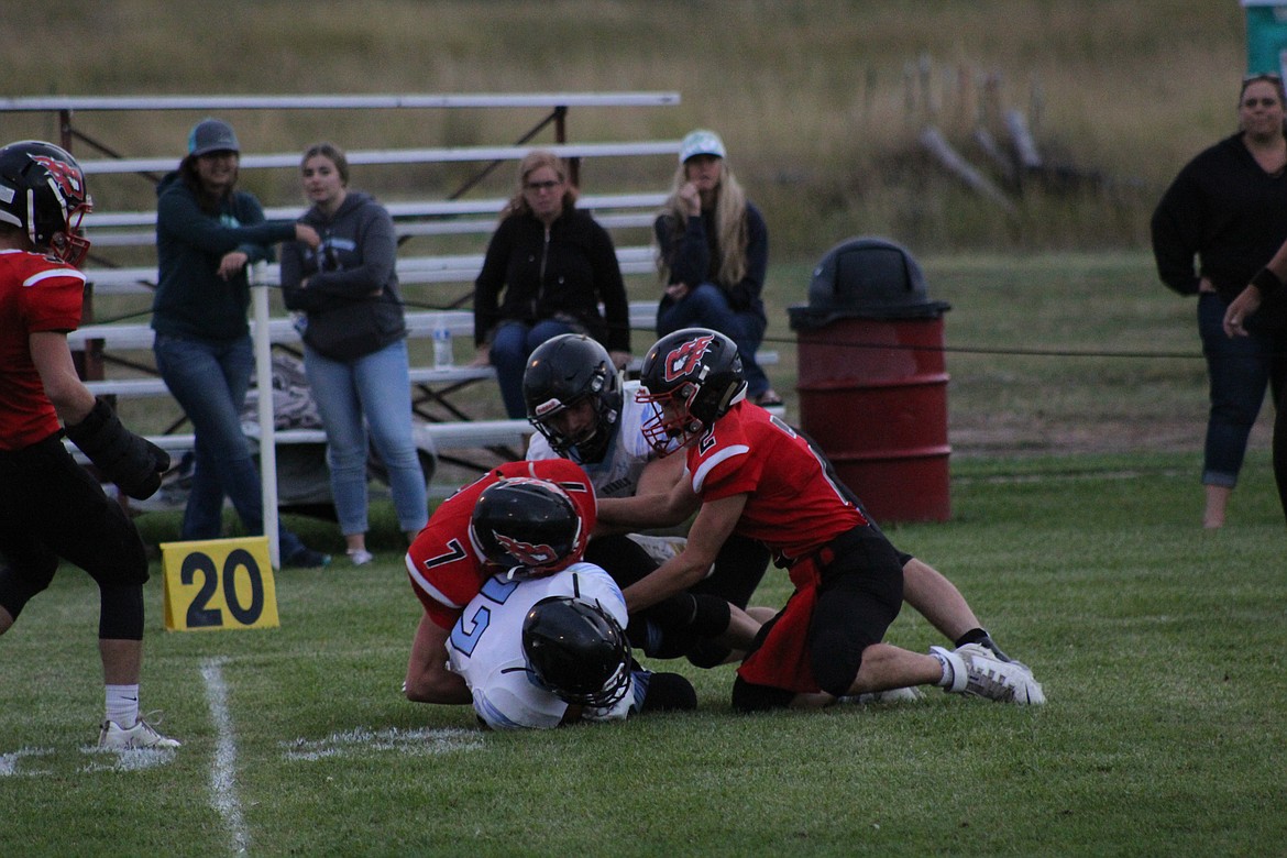 KYLE LAWSON and Lincoln Slonaker tackling during last Saturday&#146;s game. (John Dowd/Clark Fork Valley Press)