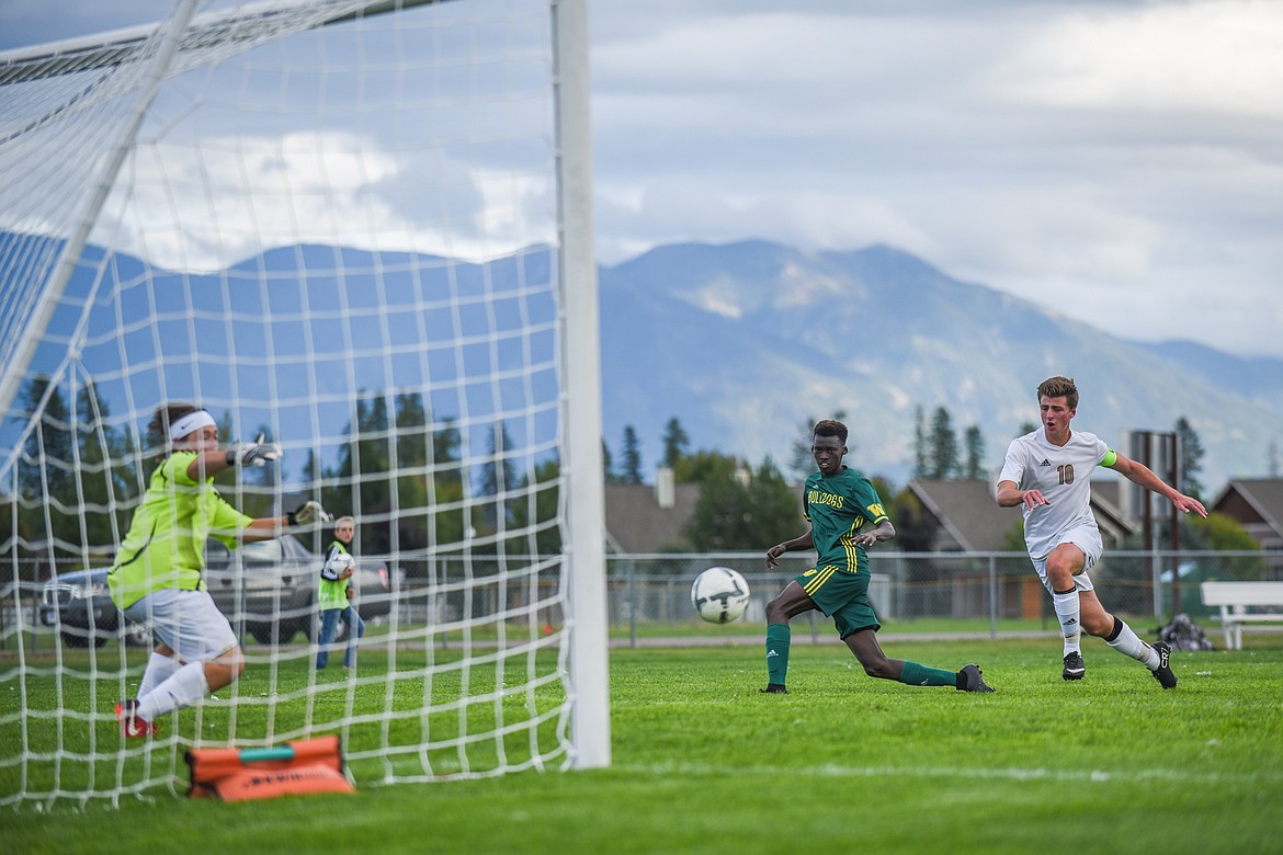 Marvin Kimera fires a goal against Polson last week at Smith Fields. (Daniel McKay/Whitefish Pilot)