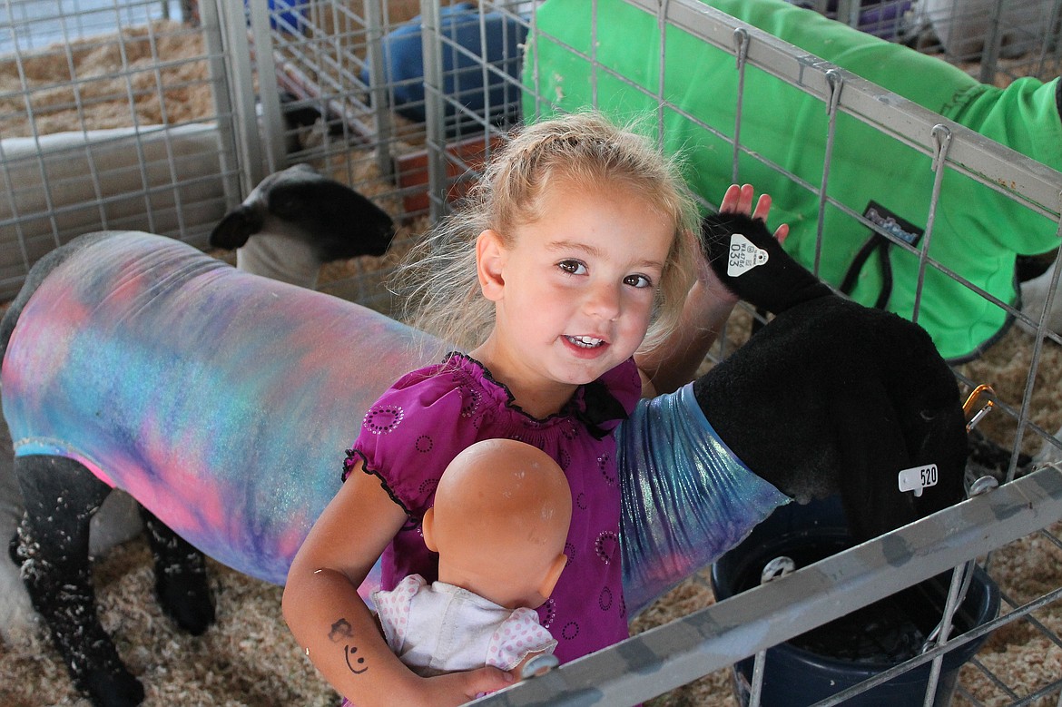 File photo
Three-year-old Gracie Wade shows off her lamb Ghost and her doll Ippy during the Othello Fair.