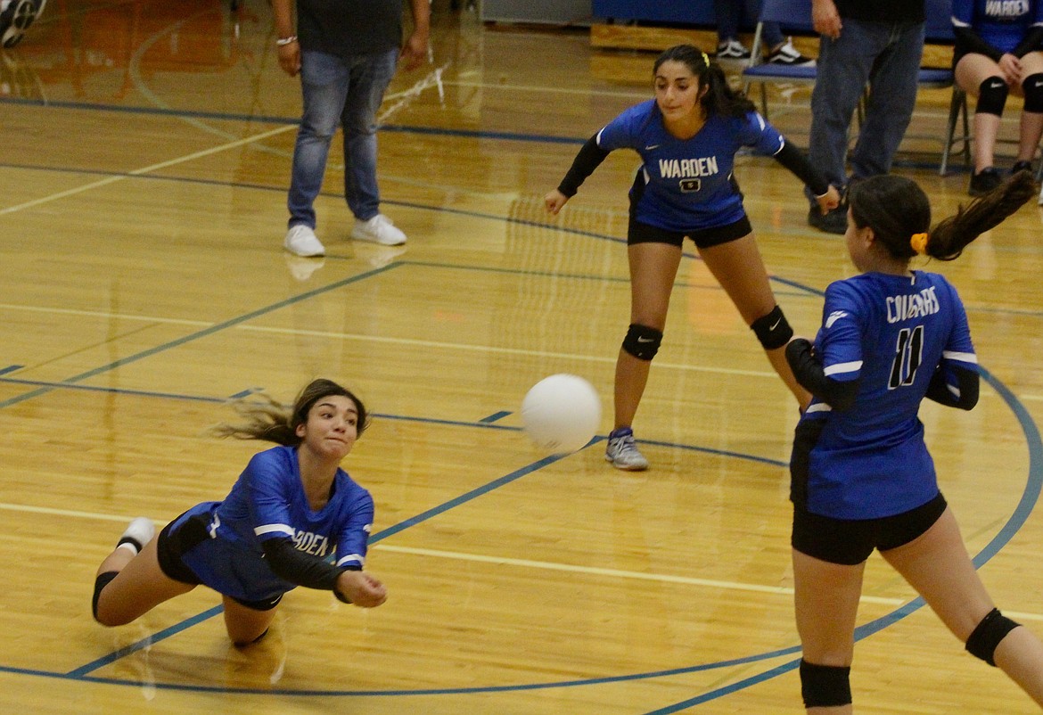 Casey McCarthy/Sun Tribune
Kiana Rios dives for the ball against Connell in the Cougars&#146; opening match of the season.